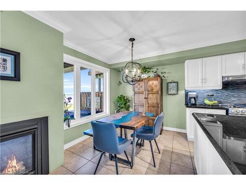 23-515 North Service Road, Stoney Creek, ON - Indoor Photo Showing Dining Room With Fireplace