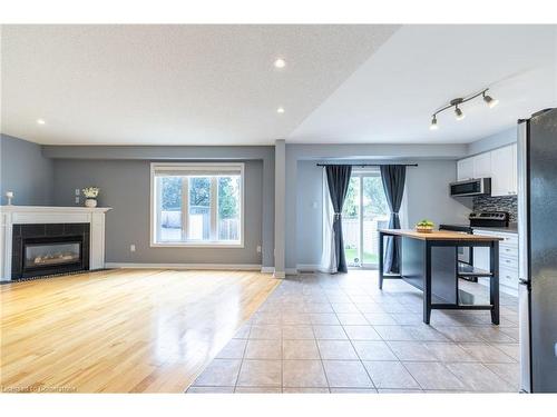 53 Dulgaren Street, Hamilton, ON - Indoor Photo Showing Living Room With Fireplace