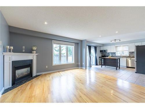 53 Dulgaren Street, Hamilton, ON - Indoor Photo Showing Living Room With Fireplace