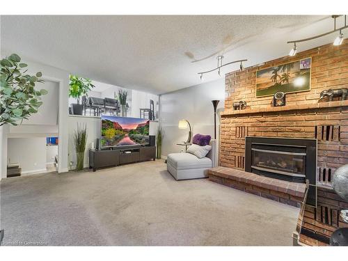 8 Muscot Drive, Hamilton, ON - Indoor Photo Showing Living Room With Fireplace