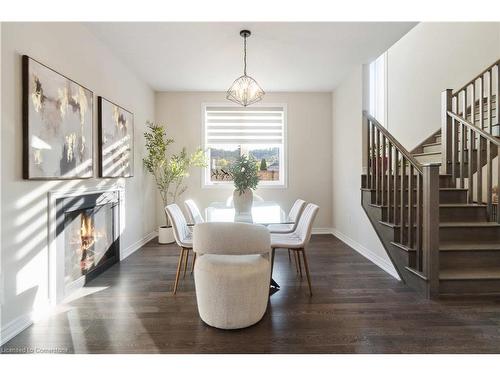 131 Starfire Crescent, Stoney Creek, ON - Indoor Photo Showing Dining Room With Fireplace