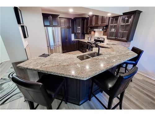 102-8111 Forest Glen Drive, Niagara Falls, ON - Indoor Photo Showing Kitchen With Stainless Steel Kitchen With Double Sink