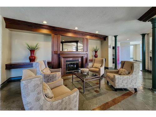 102-8111 Forest Glen Drive, Niagara Falls, ON - Indoor Photo Showing Living Room With Fireplace