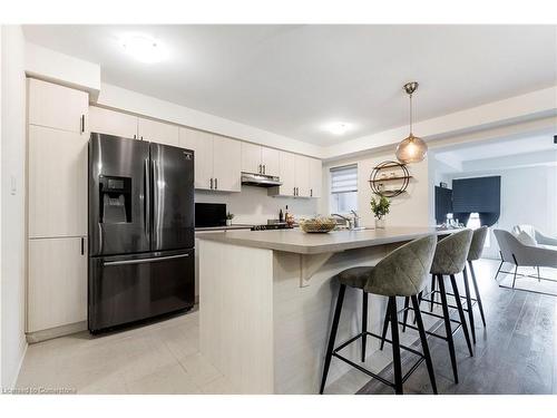 19-1125 Leger Way, Milton, ON - Indoor Photo Showing Kitchen With Upgraded Kitchen