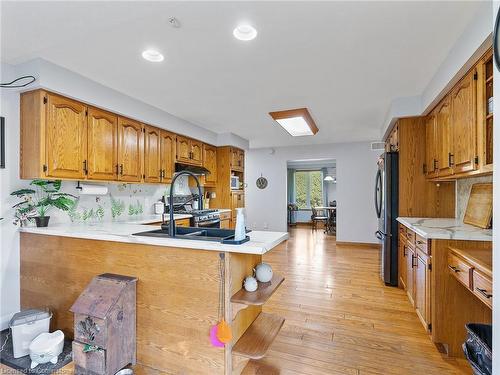 1306 St Johns Road W, Simcoe, ON - Indoor Photo Showing Kitchen With Double Sink