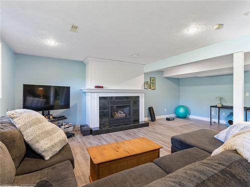 1306 St Johns Road W, Simcoe, ON - Indoor Photo Showing Living Room With Fireplace