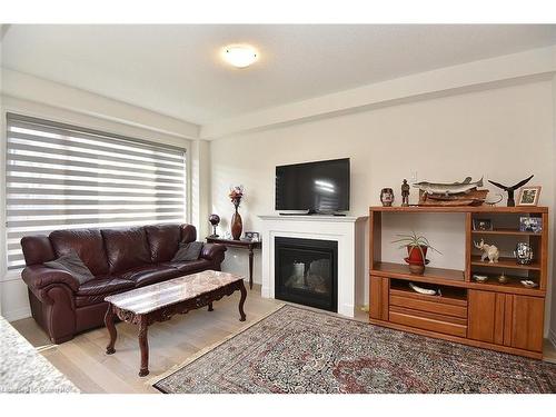 28 Fairey Crescent Crescent, Mount Hope, ON - Indoor Photo Showing Living Room With Fireplace