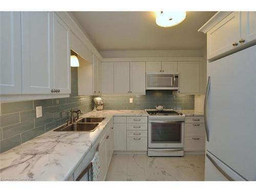 1709-301 Frances Avenue, Stoney Creek, ON - Indoor Photo Showing Kitchen With Double Sink