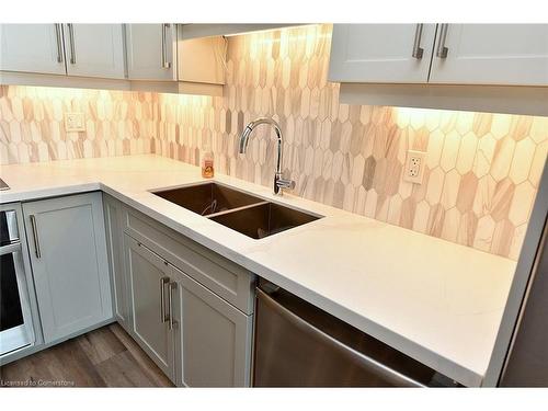 704-2025 Maria Street, Burlington, ON - Indoor Photo Showing Kitchen With Double Sink