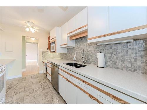 1008-2055 Upper Middle Road, Burlington, ON - Indoor Photo Showing Kitchen With Double Sink