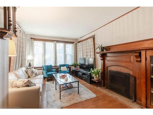 24 Burris Street, Hamilton, ON - Indoor Photo Showing Living Room With Fireplace