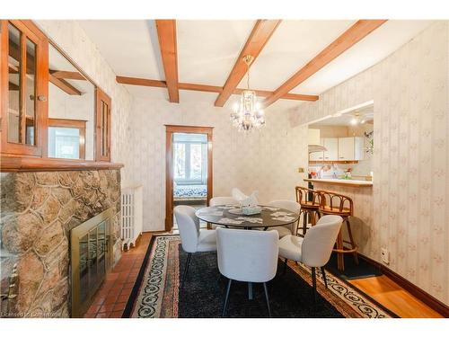 24 Burris Street, Hamilton, ON - Indoor Photo Showing Dining Room With Fireplace