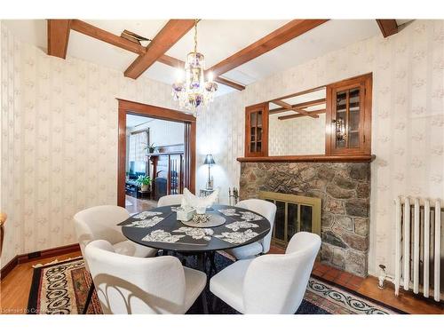 24 Burris Street, Hamilton, ON - Indoor Photo Showing Dining Room With Fireplace