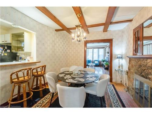 24 Burris Street, Hamilton, ON - Indoor Photo Showing Dining Room With Fireplace