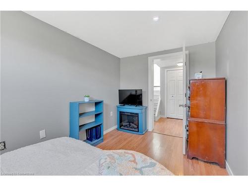 6861 Hagar Avenue, Niagara Falls, ON - Indoor Photo Showing Bedroom With Fireplace