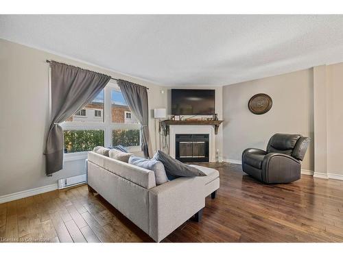 10-51 Caroga Court, Hamilton, ON - Indoor Photo Showing Living Room With Fireplace