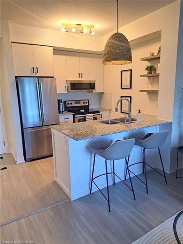 324-10 Concord Place, Grimsby, ON - Indoor Photo Showing Kitchen With Double Sink