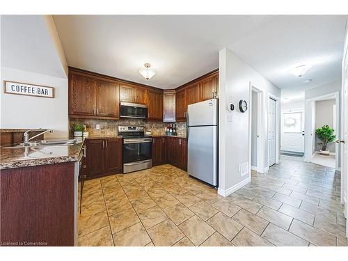 39 Thames Way, Mount Hope, ON - Indoor Photo Showing Kitchen With Double Sink