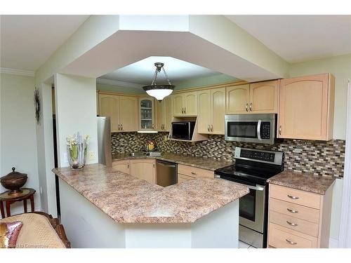 408-851 Queenston Road, Stoney Creek, ON - Indoor Photo Showing Kitchen With Double Sink With Upgraded Kitchen