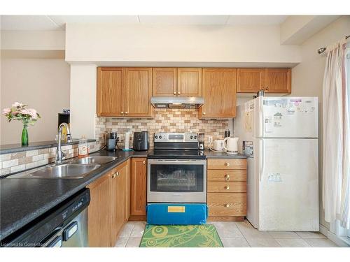 115-308 Watson Parkway N, Guelph, ON - Indoor Photo Showing Kitchen With Double Sink