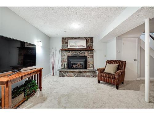 106-2301 Cavendish Drive, Burlington, ON - Indoor Photo Showing Living Room With Fireplace