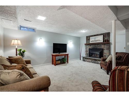 106-2301 Cavendish Drive, Burlington, ON - Indoor Photo Showing Living Room With Fireplace