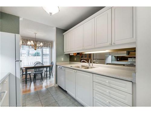 12-1275 Maple Crossing Boulevard, Burlington, ON - Indoor Photo Showing Kitchen With Double Sink