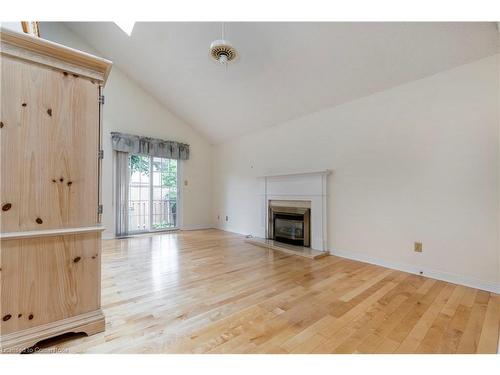 12-1275 Maple Crossing Boulevard, Burlington, ON - Indoor Photo Showing Living Room With Fireplace