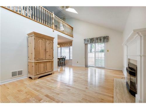 12-1275 Maple Crossing Boulevard, Burlington, ON - Indoor Photo Showing Other Room With Fireplace