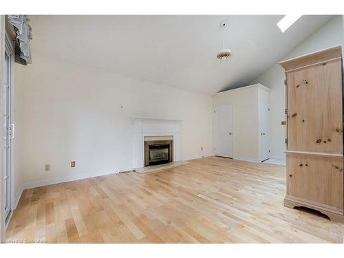 12-1275 Maple Crossing Boulevard, Burlington, ON - Indoor Photo Showing Living Room With Fireplace