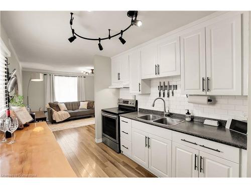 Upper-6 Homewood Avenue, St. Catharines, ON - Indoor Photo Showing Kitchen With Double Sink