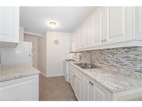 703-335 Mill Road, Etobicoke, ON - Indoor Photo Showing Kitchen With Double Sink