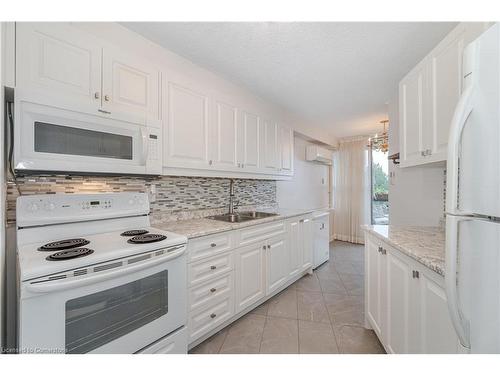 703-335 Mill Road, Etobicoke, ON - Indoor Photo Showing Kitchen With Double Sink