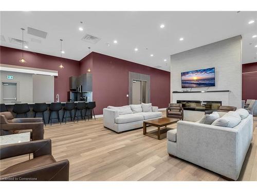 304-560 North Service Road, Grimsby, ON - Indoor Photo Showing Living Room With Fireplace