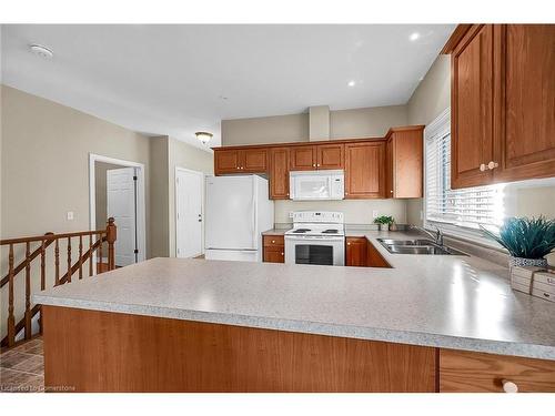 17-1041 Pine Street, Dunnville, ON - Indoor Photo Showing Kitchen With Double Sink