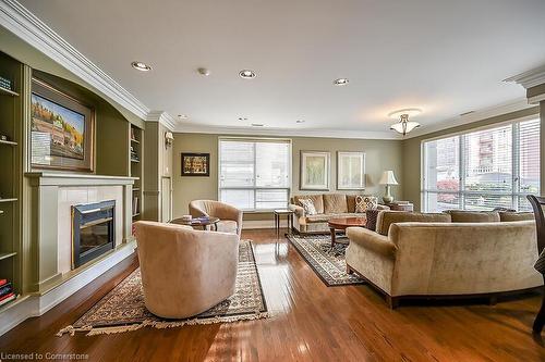 601-3000 Creekside Drive, Dundas, ON - Indoor Photo Showing Living Room With Fireplace