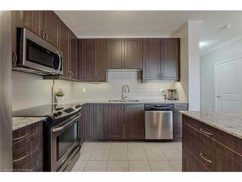 216-33 Whitmer Street, Milton, ON - Indoor Photo Showing Kitchen With Double Sink With Upgraded Kitchen