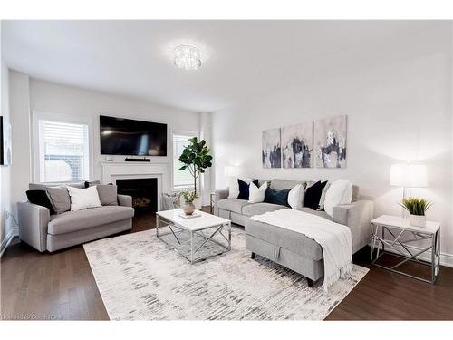 278 Fasken Court, Milton, ON - Indoor Photo Showing Living Room With Fireplace