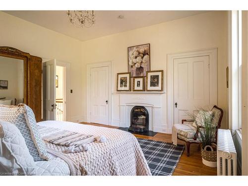 30 South Street W, Dundas, ON - Indoor Photo Showing Bedroom With Fireplace