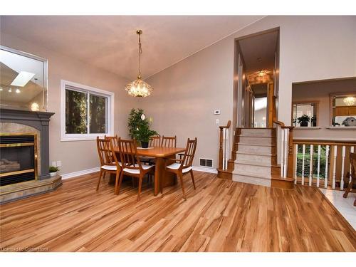 282 Winterberry Drive, Stoney Creek, ON - Indoor Photo Showing Dining Room With Fireplace