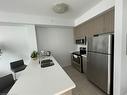 208-5020 Corporate Drive, Burlington, ON  - Indoor Photo Showing Kitchen With Stainless Steel Kitchen With Double Sink 