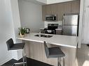 208-5020 Corporate Drive, Burlington, ON  - Indoor Photo Showing Kitchen With Stainless Steel Kitchen With Double Sink 