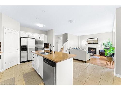 9 Tolton Drive, Guelph, ON - Indoor Photo Showing Kitchen With Fireplace With Double Sink