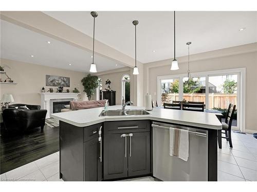 229 John Frederick Drive, Ancaster, ON - Indoor Photo Showing Kitchen With Fireplace With Double Sink