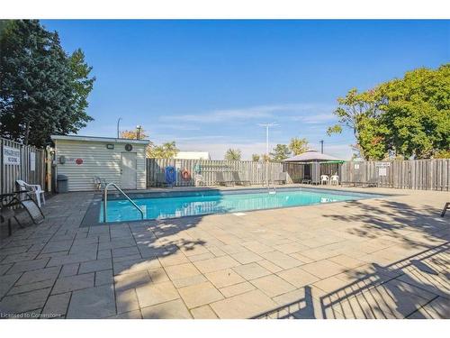 206-700 Dynes Road, Burlington, ON - Outdoor With In Ground Pool