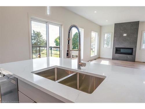 11435 Morgans Point Road, Wainfleet, ON - Indoor Photo Showing Kitchen With Fireplace With Double Sink