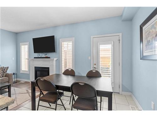 55 Sonoma Valley Crescent, Hamilton, ON - Indoor Photo Showing Dining Room With Fireplace