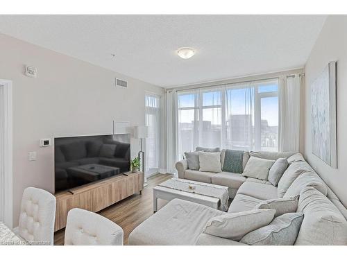 705-16 Concord Place, Grimsby, ON - Indoor Photo Showing Living Room