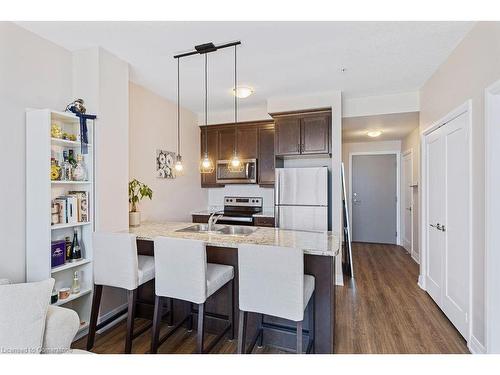 705-16 Concord Place, Grimsby, ON - Indoor Photo Showing Kitchen With Double Sink