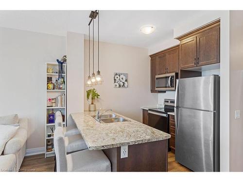 705-16 Concord Place, Grimsby, ON - Indoor Photo Showing Kitchen With Double Sink